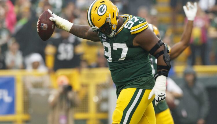 Kenny Clark receives help

