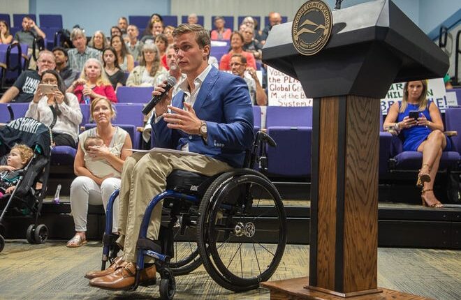 In this August file photo, Congressman Madison Cawthorn speaks during a meeting with the Buncombe County Board of Education.  In November Cawthorn visited a private museum in Texas where he rode in a wheelchair once used by President Franklin Delano Roosevelt.