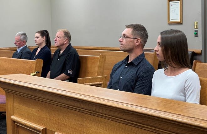 Riley Sowle and Anita Jensen of Oconto, right, listen as an attorney makes an argument in Oconto County Circuit Court on Wednesday, about whether an injunction should be granted to stop their business, Oconto Riviera, from operating.  At left, from right, Oconto Mayor John Panetti, City Administrator Brittney Bickel and City Attorney Frank Calvert also attended the hearing.  An Oconto couple, Dale and Heather Thomson, is suing the city, Sowle and Jensen and is seeking them from operating their wedding and special event venue.