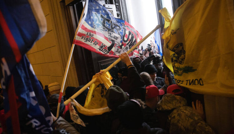 WASHINGTON, DC - JANUARY 06: A pro-Trump mob breaks into the U.S. Capitol. Congress held a joint session today to ratify President-elect Joe Biden's 306-232 Electoral College win over President Donald Trump. A group of Republican senators said they would reject the Electoral College votes of several states unless Congress appointed a commission to audit the election results. (Photo by Win McNamee/Getty Images)