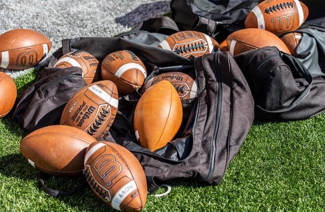 Footballs lay on the sideline during Mukwonago's scrimmage against Marquette on Friday, August 13, 2021.