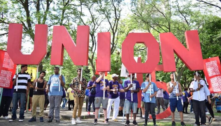 Union sign held by labor protesters