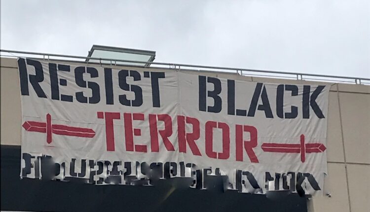 The banner which was hung from the Waukesha Transit Center. It has been edited to remove a website for the neo-nazi group. (Photo 