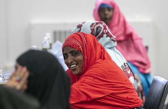 Zeinab Omar smiles while waiting for the Fundamentals of Infant and Toddler Care class to begin Sunday, Sept. 11 at Family and Child Care Resources of Northeast Wisconsin in Green Bay.  The class is being offered to Somali women, with the help of a translator, as part of the Culturally Responsive Child Care Partnership.