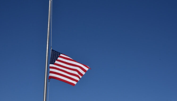 Flag at half staff (phot by Circe Denyer, public domain CC0)