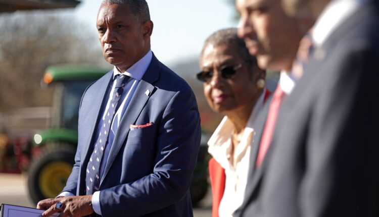 WASHINGTON, DC - DECEMBER 14: District of Columbia Attorney General Karl Racine (L) listens during a news conference on the January 6th insurrection December 14, 2021 on Capitol Hill in Washington, DC. Racine announced that the District of Columbia is suing the Oath Keepers and Proud Boys for damages from the insurrection. (Photo by Alex Wong/Getty Images)