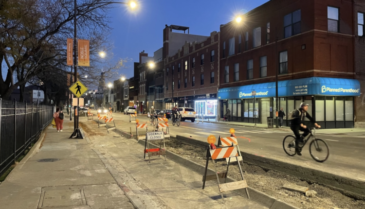 A bus boarding island that doubles as bike lane protection under construction at Milwaukee and Haddon Avenue (1130 N.) earlier this month, looking south. Photo: Steven Vance