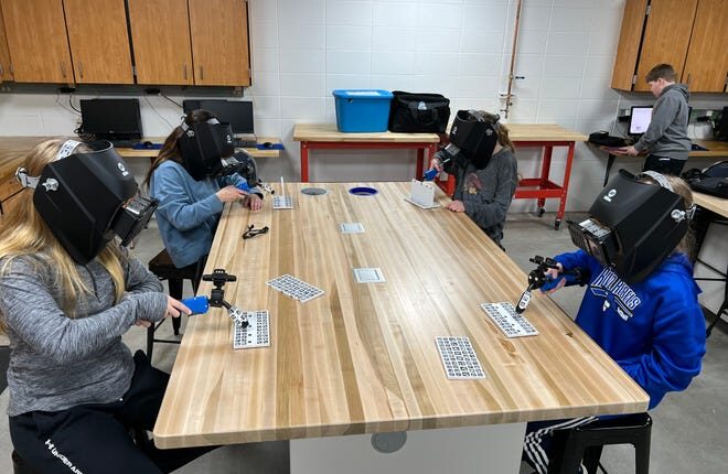 Oconto Middle School students practice welding techniques via a MobileArc Augmented Reality Welding System.